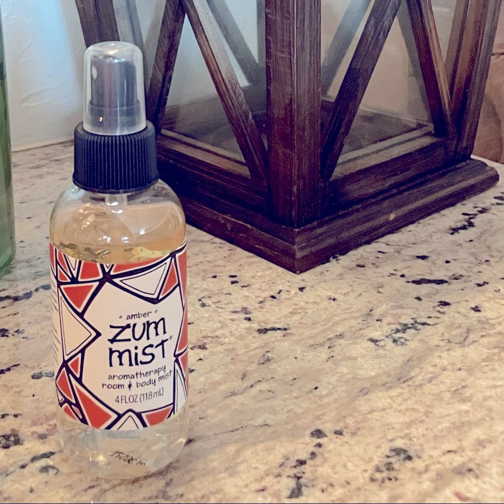 Three new bottles of indigo wild amber spray